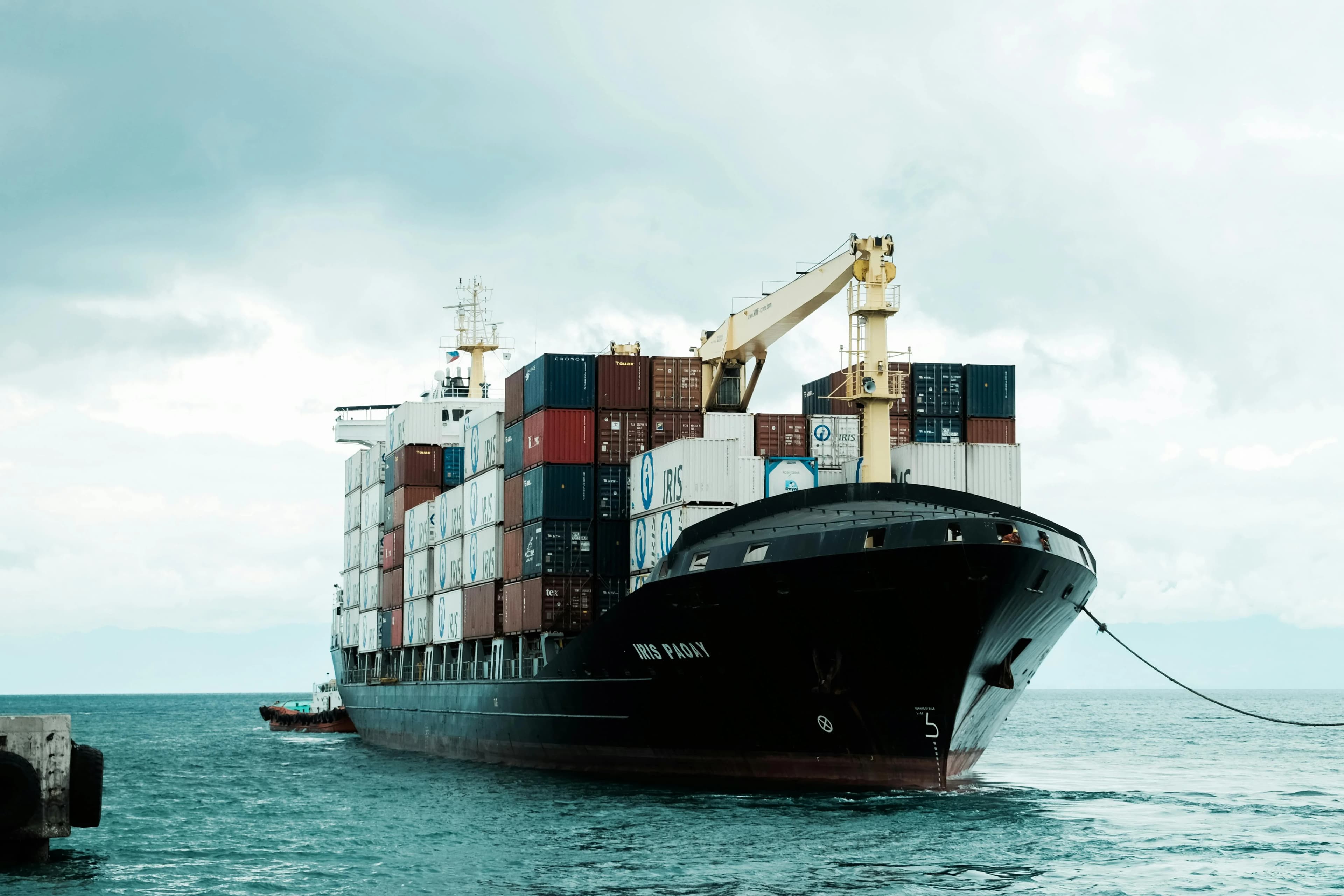 Port crane moving shipping containers