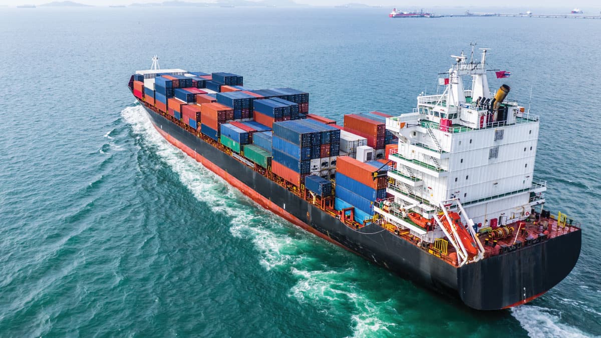 Container vessel at sea during ocean freight transport